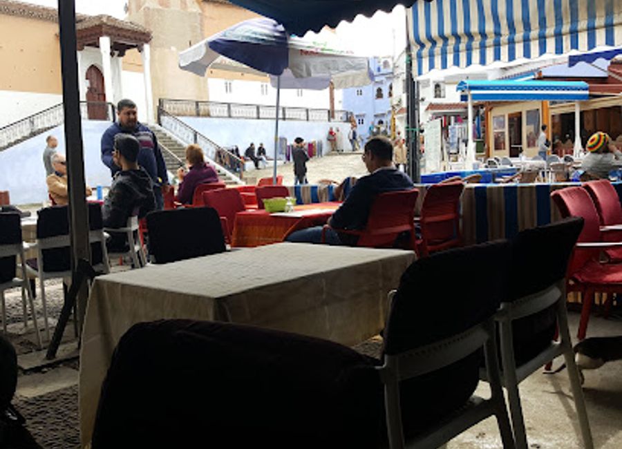 Experience authentic Moroccan cuisine at Restaurant Ali Baba in Chefchaouen's enchanting blue streets.