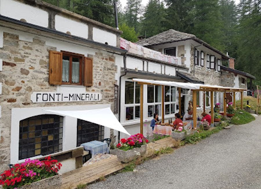 Discover authentic Italian cuisine amidst stunning alpine landscapes at Rifugio Le Fonti Minerali - your perfect escape in Ceresole Reale.