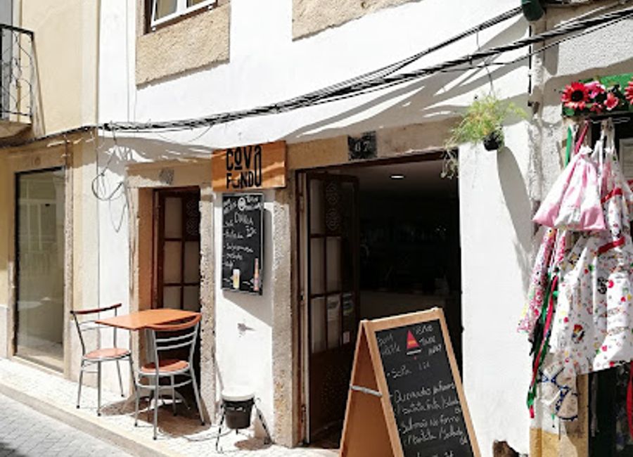 Discover authentic Portuguese cuisine at Cova Funda in Tomar, renowned for its slow-cooked goat meat and warm ambiance.