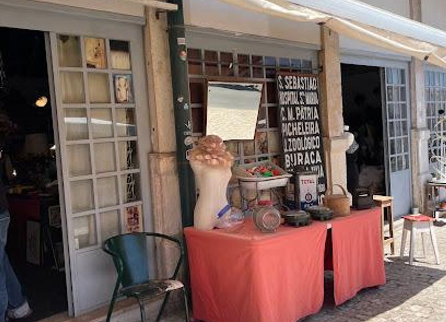 Discover unique treasures and local crafts at Lisbon's historic Feira da Ladra flea market in Campo de Santa Clara.