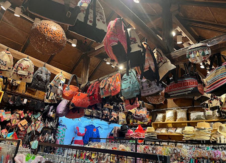 Discover unique handicrafts and traditional clothing at Sa Pa's vibrant Souvenir & Clothing Shop, a perfect stop for memorable gifts.