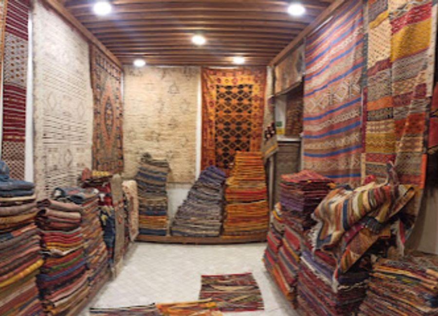 Explore the exquisite carpets and unique antiques at Coin Berbere, a family-owned gem in the heart of Fes, Morocco.
