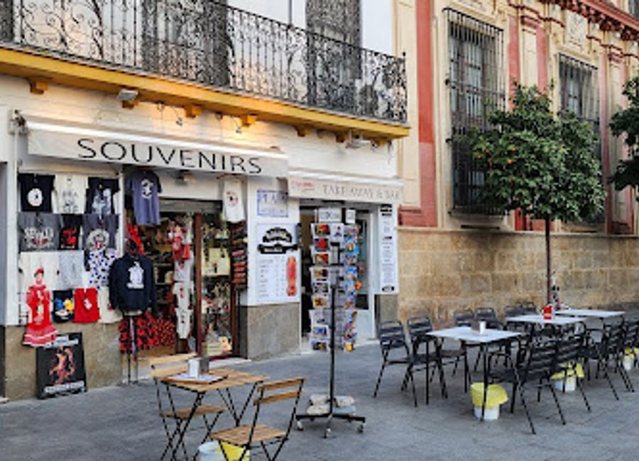 Discover unique Andalusian crafts at Souvenir Patio de los Naranjos, a charming gift shop in Seville's Casco Antiguo, perfect for memorable souvenirs.