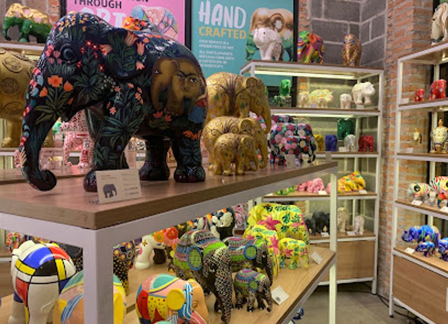 Discover a unique selection of handcrafted elephant-themed souvenirs at Elephant Parade in Chiang Mai, supporting local artisans and conservation efforts.