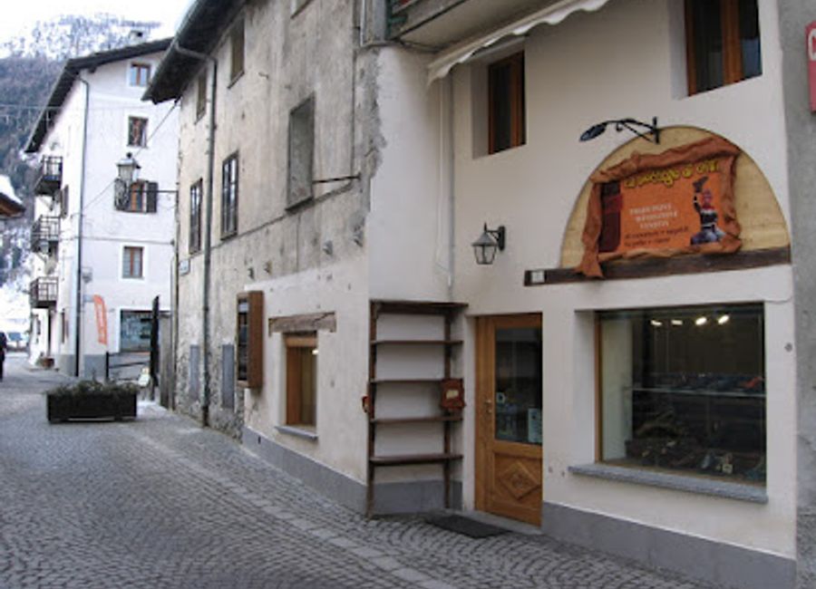 Discover La Bottega di Gibi in Cogne, where handcrafted shoes meet local artistry in a charming shopping experience.