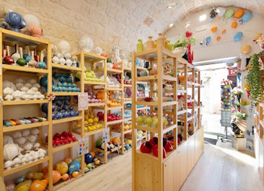 Explore the exquisite pottery and unique souvenirs at Libellula Group SRL, a treasure trove of artistic craftsmanship in Polignano a Mare.