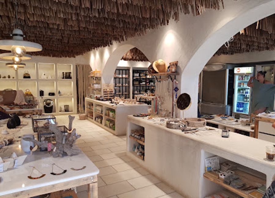 Explore Yazoo Concept Store on Plaka Beach - a boutique paradise featuring unique local art, fashion, and accessories in a breathtaking coastal setting.