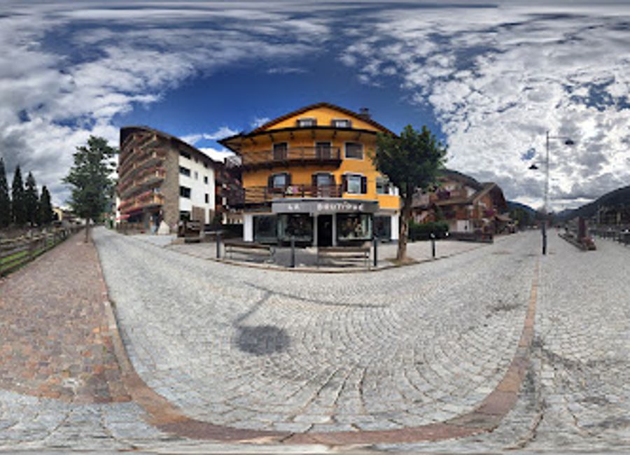 Explore unique fashion at La Boutique in Moena, a charming clothing store that embodies the essence of local Italian style amidst stunning alpine scenery.