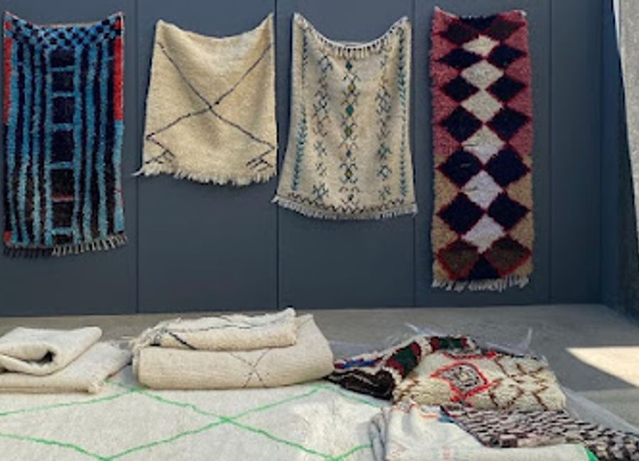 Explore the rich tapestry of Moroccan culture through exquisite handicrafts and carpets at the Morocco Products Shop in Merzouga.