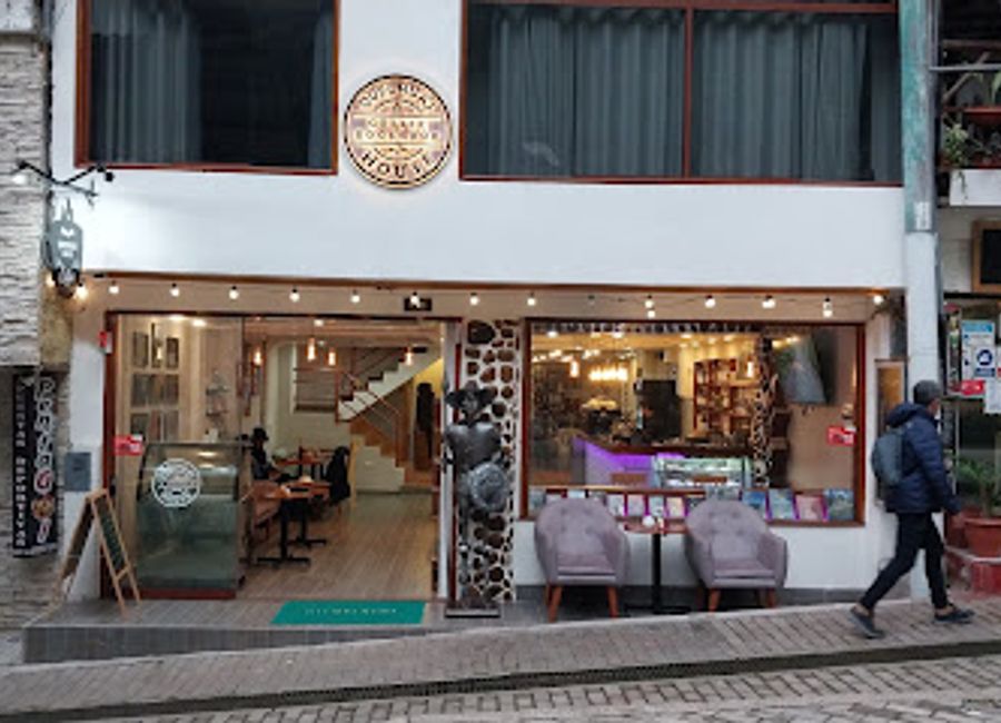 Discover Aguas Calientes' hidden gem, Quechua's House, where coffee culture meets literary charm in a serene setting.